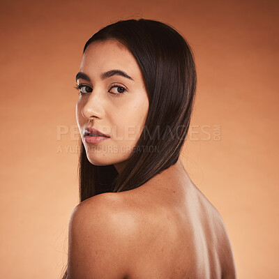 Buy stock photo Beauty, body and haircare portrait of a young woman posing for cosmetic treatment advertisement on studio background. Hairstyle, bodycare and health and wellness care for skin of hispanic female 