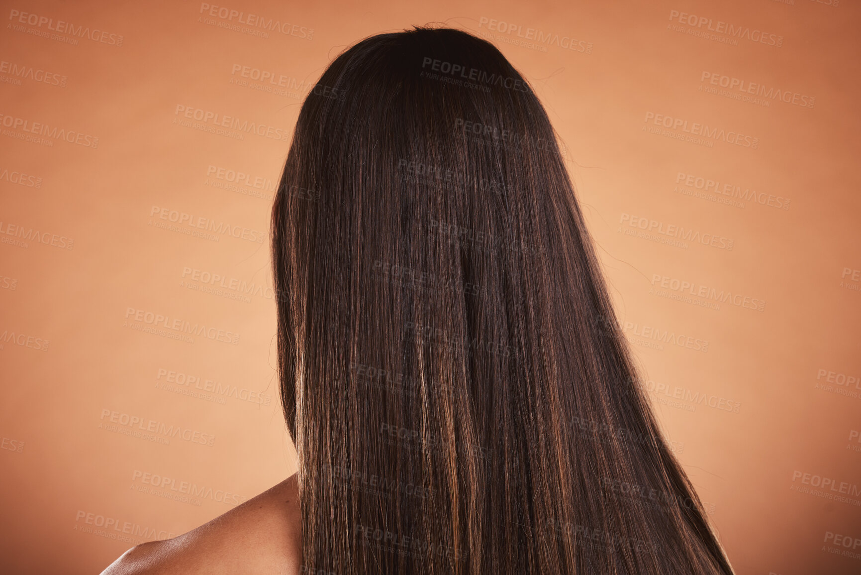 Buy stock photo Woman, brown hair balayage and hair care, beauty salon shampoo and shine, smooth texture and extension wig, hair dye color or cosmetics on studio orange background. Back head of model long hair style