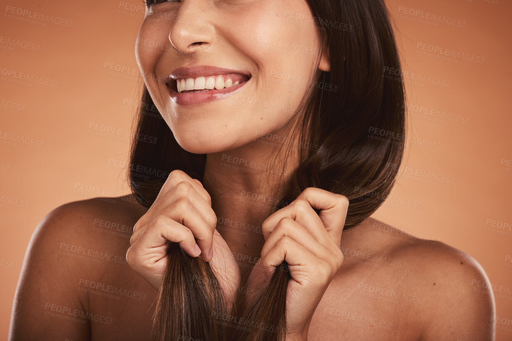 Buy stock photo Hair care, dental and face skincare of woman on brown studio background. Makeup, oral health and smile of female model holding long and healthy hair after luxury salon treatment for new hair style.

