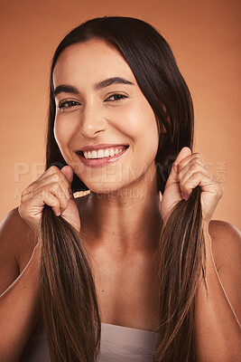 Buy stock photo Portrait, happy and beauty woman with healthy hair and skin smiling against orange studio background. Latino model with skincare wellness and natural beauty with smile with strong healthy haircare