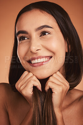 Buy stock photo Makeup, happy and woman thinking of cosmetic care against a brown studio background. Spa, skincare and face of girl model with an idea and smile for luxury wellness, beauty health and cosmetics