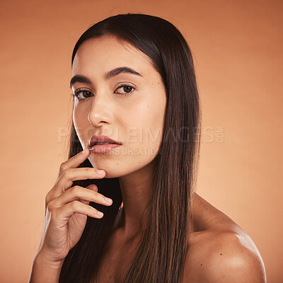 Buy stock photo Beauty, woman and portrait in studio for skincare, wellness and grooming against orange background mockup. Face, hair and girl model proud, confident and fresh after hygiene, treatment and cosmetics
