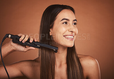 Buy stock photo Flat iron woman, hair care studio and beauty cosmetics with smile against brown background. Hair health happiness, hairdresser cosmetic girl and happy hairstyle for wellness self care, tech and heat