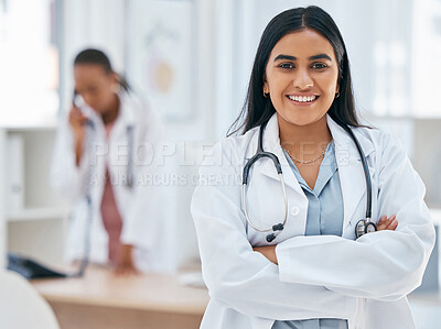 Buy stock photo Indian woman, doctor and arms crossed in hospital with trust, wellness goals or healthcare motivation. Portrait, smile or happy medical worker, life insurance employee or friendly consulting surgeon 