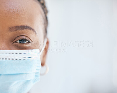 Buy stock photo Covid, face mask and portrait of doctor working in hospital with safety, compliance and vision in eye for health, healing and innovation. Black woman in healthcare and medical field during covid 19