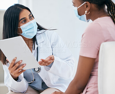 Buy stock photo Black woman covid, doctor tablet results and talking in hospital office for healthcare report discussion. Woman digital medic, corona technology for diagnosis and medical conversation for clinic help