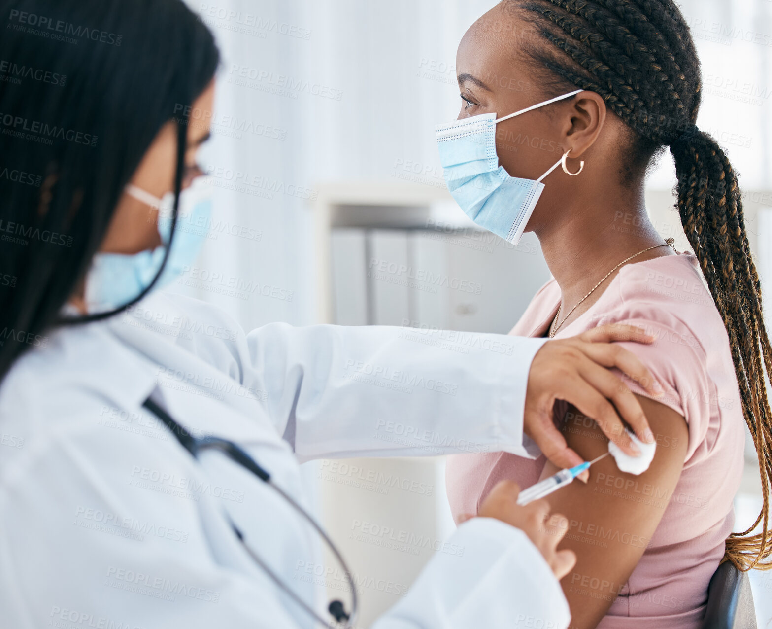 Buy stock photo Doctor, covid mask and vaccine of a woman patient with medicine injection in hospital or clinic. Healthcare, nurse and consulting medical worker with health vaccination and black woman consultant 