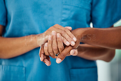 Buy stock photo Healthcare, holding hands and doctor with patient in a hospital after bad news of cancer, sickness and disease. Hand, nurse and medical support by woman showing empathy, hope and comfort