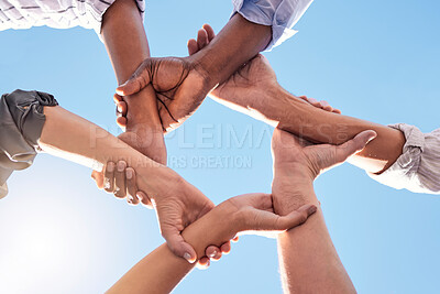 Buy stock photo Hands, community and link team together global community of cooperation on blue sky. Group diversity in volunteer partnership, social solidarity or collaboration friends of circle arms and teamwork