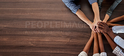 Buy stock photo Business people, hands and teamwork above in support, trust or community on mockup background. Group hand of employee workers together in diversity, collaboration and care for unity with copy space
