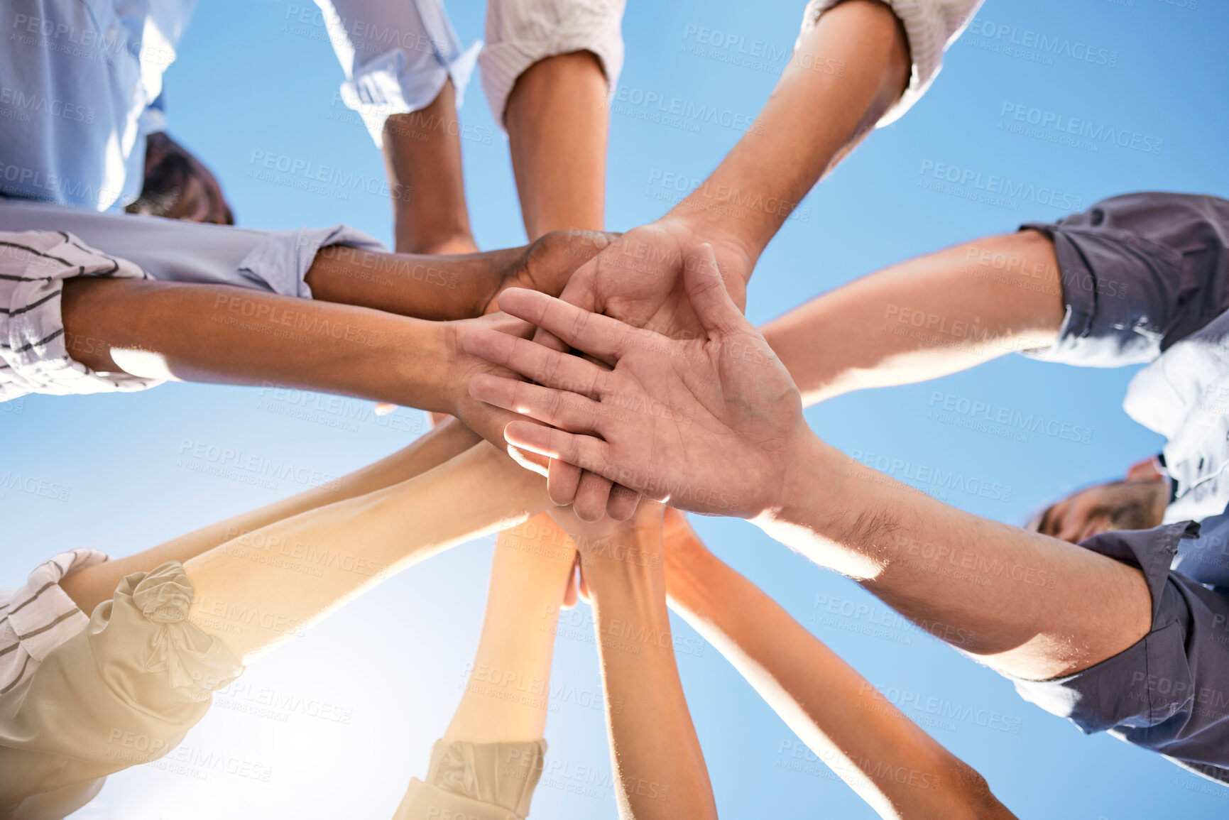 Buy stock photo Low angle, hands and circle in success, solidarity or support team building, teamwork collaboration or diversity celebration. Men, women and friends in community huddle for business motivation goals