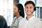 Man, consultant and call center with smile for customer service, telemarketing or advice at the office. Happy male employee smiling with headset in contact us, consulting or desktop support agency