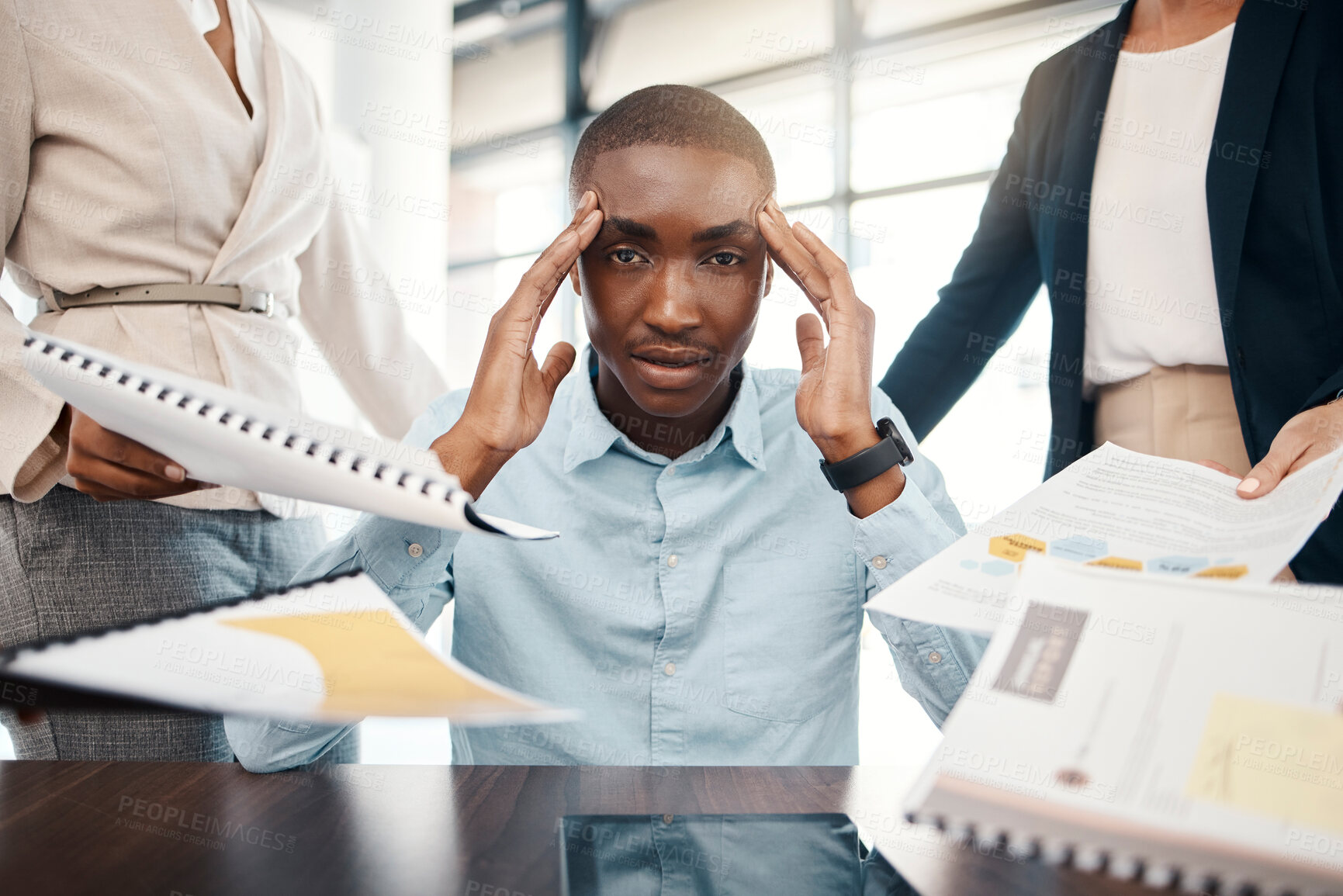 Buy stock photo Headache, overwhelmed businessman and work report stress in office with team. Black man, stressed business management leader and corporate mental health burnout or frustrated employee depression