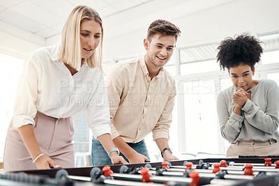 Buy stock photo Business people, foosball table and competition in office for team building, motivation and teamwork in startup company. Group diversity employees playing creative soccer games for fun collaboration 
