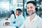 Call center, telemarketing, and customer service consultant wearing a headset and looking happy at the office. Contact us and crm agent man with sales team for support, help and service with a smile
