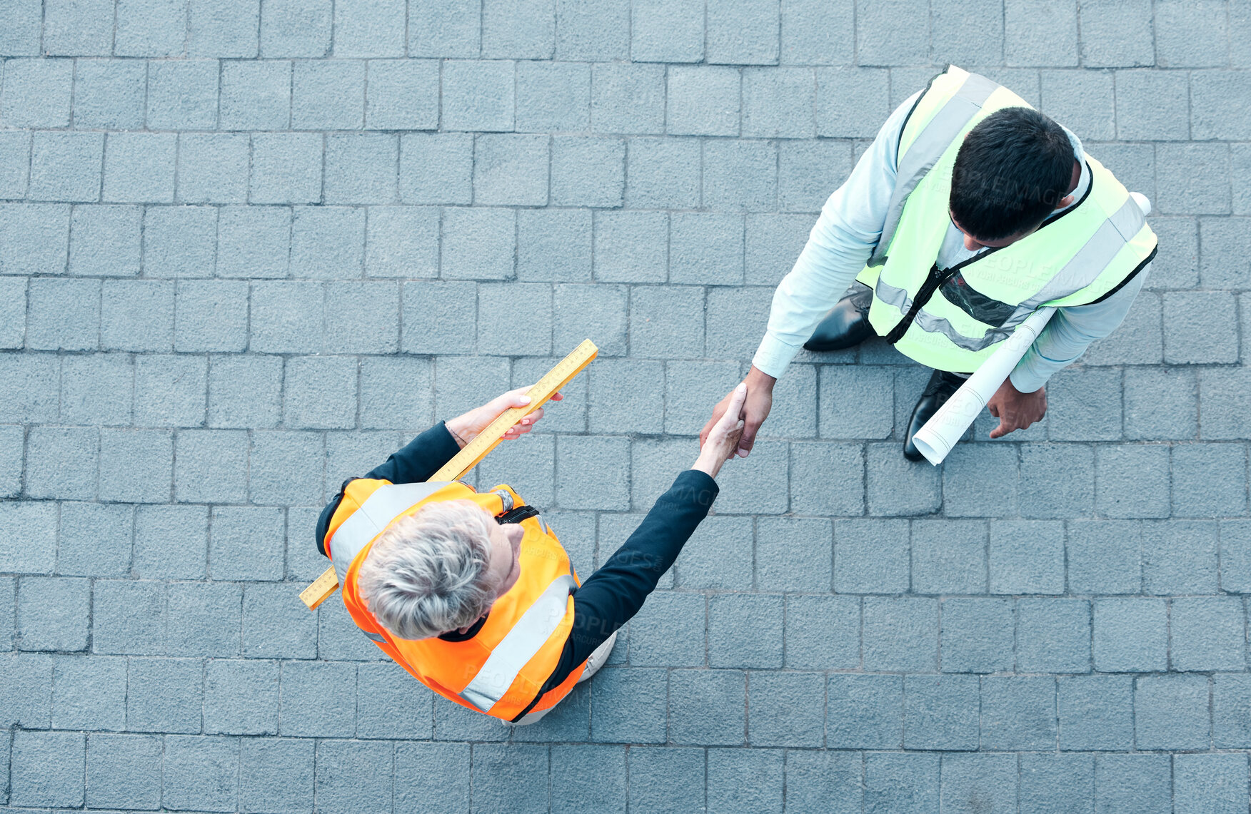 Buy stock photo Builder, construction worker and architect handshake with aerial view of teamwork, labor collaboration and industrial project workers. Men shaking hands, thank you and engineering building contractor
