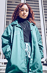 Portrait, fashion and city with a model black woman posing outdoor in summer for contemporary clothing. Street, style and clothes with an attractive young female wearing an edgy or trendy outfit