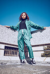 Green, designer and fashion black woman in urban city portrait pm blue sky mock up for marketing, advertising or youth promotion. Young gen z girl streetwear design clothes with mockup rooftop space