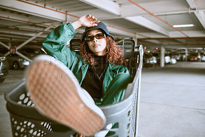 Buy stock photo City, parking lot and woman sitting in shopping cart with urban fashion and cars parking in background. Cool hip hop street style, fun girl from Brazil with freedom and youth on weekend in Sao Paulo.