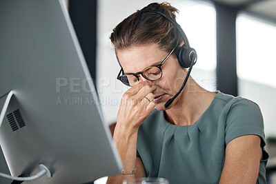 Buy stock photo Stress, burnout and call center consultant with a headache while networking for a communications company. Tired, mental health and frustrated telemarketing sales agent with a migraine pain problem