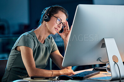 Buy stock photo Call center, woman and stress at night with computer, stressed and overworked in office, tired and headache. Female consultant frustrated, experience burnout and headset, anxiety and mental health.