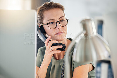 Buy stock photo Telephone, phone call and business woman in office, talking and thinking. Landline, communication and female employee from Canada on call speaking, chatting or work discussion in company workplace.

