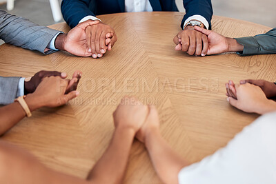 Buy stock photo Teamwork, trust and business people holding hands in meeting for support, unity and agreement. Collaboration, diversity and group of workers at desk with joined hands in circle, united together