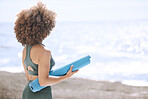 Woman, yoga mat and enjoying ocean and view before zen, peaceful and relaxing exercise. Scenic view, yogi and woman ready to meditate at beach. Nature, african american woman and meditation by sea
