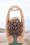 Black woman afro, heart sign and stretching in wellness, exercise or healthy lifestyle in the outdoors. African American female in morning expression or stretch with hands for love gesture or emoji