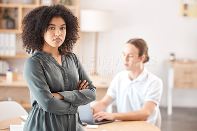 Buy stock photo Portrait, business woman and ceo arms folded leaning on desk in office. Young African American female, confident corporate manager and startup entrepreneur with employee working in background
