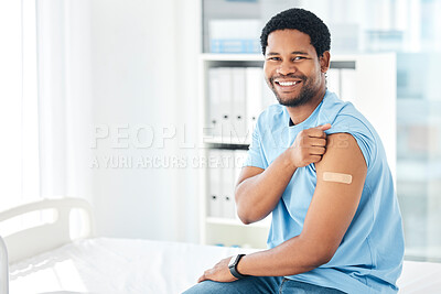 Buy stock photo Black man, band aid and covid vaccine success in hospital in global virus safety, security or life insurance wellness. Portrait, happy smile and covid 19 injection patient with healthcare arm plaster