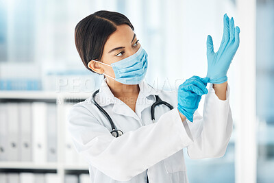 Buy stock photo Healthcare, covid and a doctor putting gloves on hands, woman ready for check up examination or surgery in hospital or clinic. Safety, protection and lady medical worker with surgical face mask.