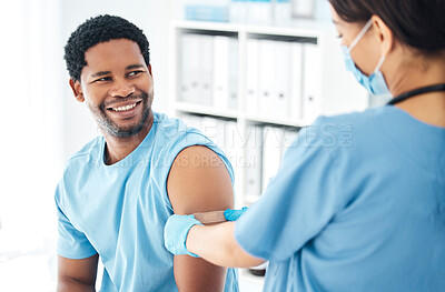 Buy stock photo Doctor, vaccine and covid bandaid on arm of man patient for healthcare, medical vaccination and consultation. Hospital nurse with a plaster for an injury, virus or safety while sick and face mask