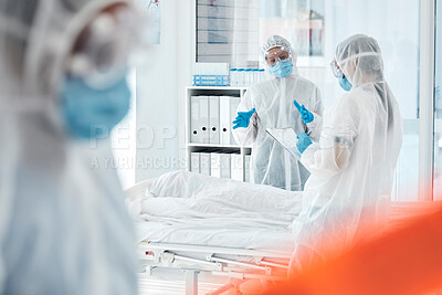 Buy stock photo Covid, death and doctors writing report in a hospital for compliance, cause and records in a room. Documents, dead body and medical team discussing patient loss, information and cause of death