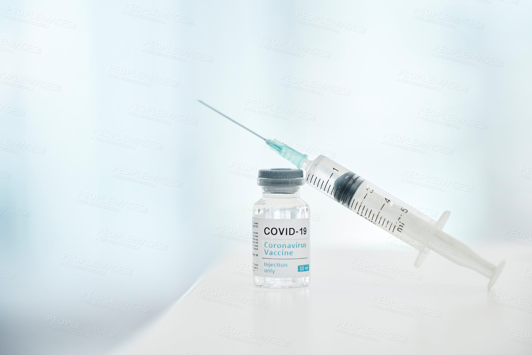 Buy stock photo Covid, vaccine and syringe with bottle for safety, health and protection from virus in hospital with mockup space. Zoom of container, medicine and pharmaceutical product for covid 19 for healthcare