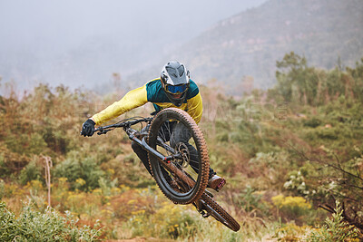Buy stock photo Mountain bike, man and air jump, action and bicycle stunt, challenge and adventure, freedom or dynamic risk in outdoor competition race. Biker athlete, sports adrenaline and energy for extreme sports
