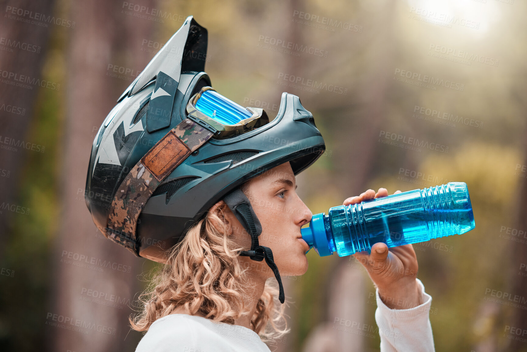 Buy stock photo Fitness, cycling and drinking water with man in mountain, training for sports, health and workout. Energy, nature and exercise with athlete and helmet for wellness, summer and bike riding in forest