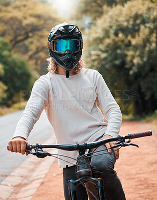 Buy stock photo Mountain bike, helmet and fitness with a man athlete sitting on his bicycle while outdoor in nature for a ride. Road, cycling and sport with a male rider training outside for exercise or workout