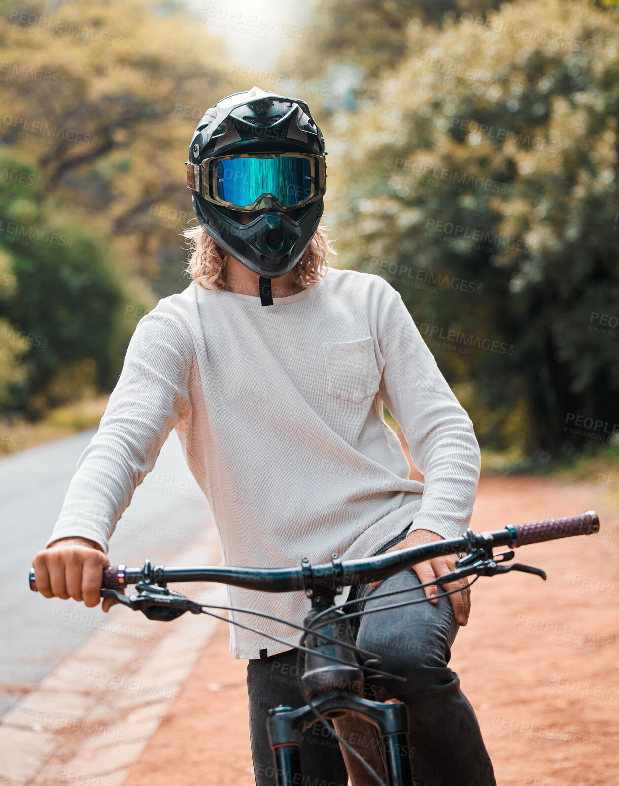 Buy stock photo Mountain bike, helmet and fitness with a man athlete sitting on his bicycle while outdoor in nature for a ride. Road, cycling and sport with a male rider training outside for exercise or workout