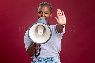 Buy stock photo Black woman, protest and shouting with megaphone for voice, strike or stop against a studio background. Portrait of African female activist with hand gesture, vocal or stand for gender based violence