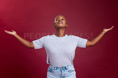 Buy stock photo Happy black woman, open arms and advertising mockup for marketing against a red studio background. African American female model embracing freedom, sale or deal for product, announcement or welcome