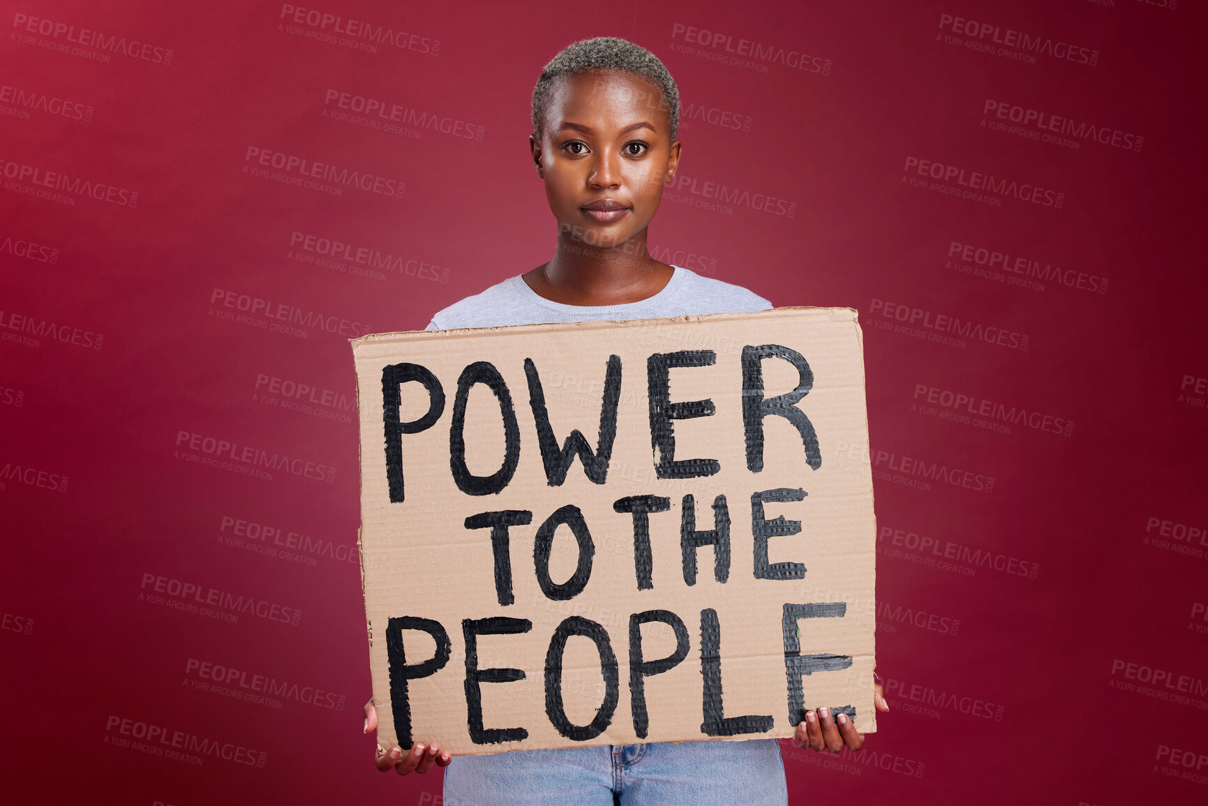 Buy stock photo Poster, woman and studio banner power to the people sign by black woman vote, change and empowerment on red background. Portrait, girl and voter message with equality, transformation and human rights