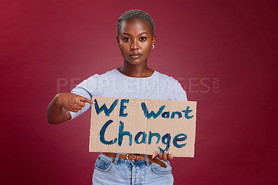 Buy stock photo Black woman, cardboard sign and protest for change, end racism and equality for people on studio background. Young girl, point to poster and human rights to fight against discrimination and gesture.