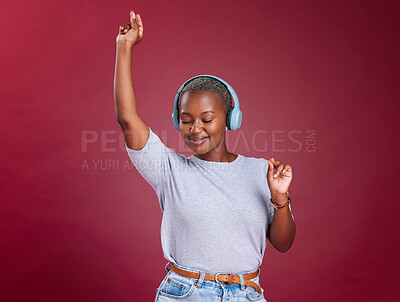 Buy stock photo Studio, dance and black woman streaming music and dancing with freedom and happiness to relax. Smile, headphones and happy African girl enjoys listening to a gospel worship song or audio on radio