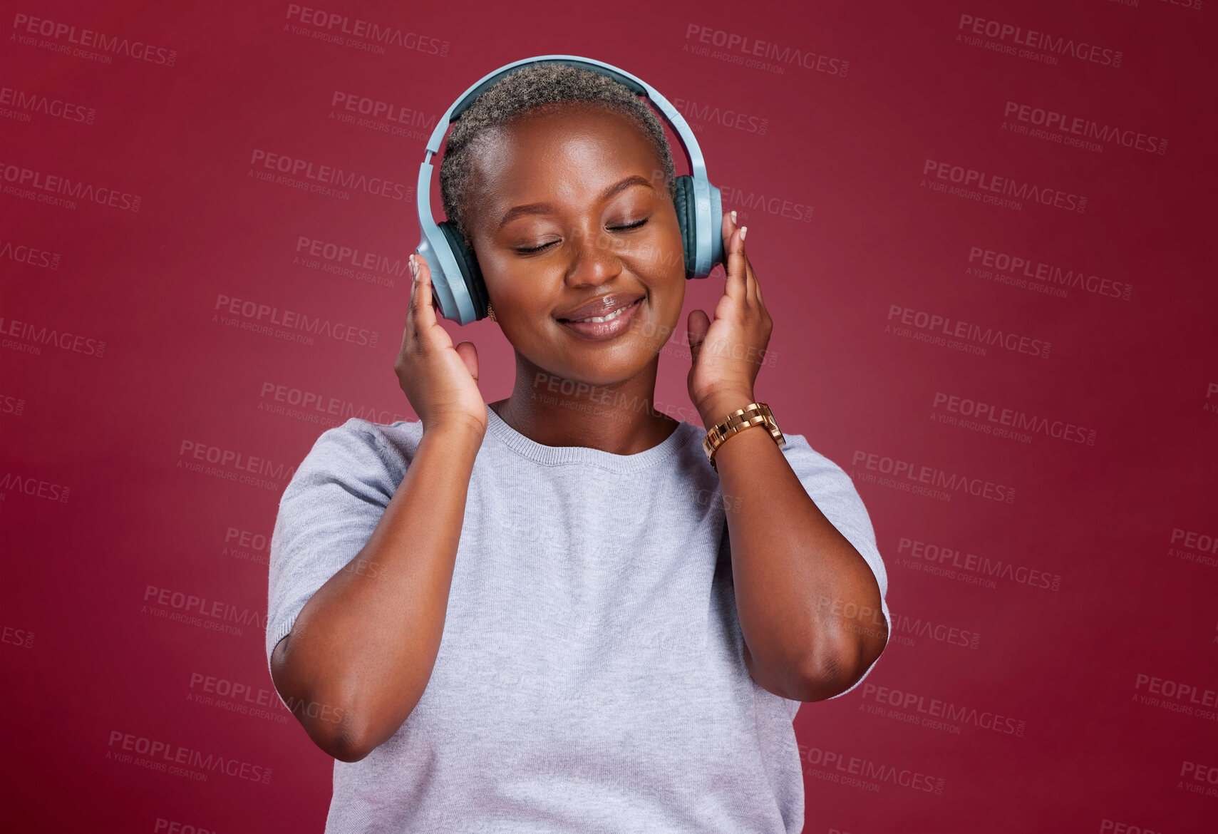 Buy stock photo Black woman, headphones and smile for music listening, streaming or relax against a studio background. African American female with smile enjoying audio track, hifi or relaxing with wireless headset