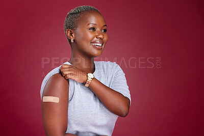 Buy stock photo Covid, vaccine and arm with a black woman in studio on a red background with mockup to promote health. Medical, medicine and healthcare with a female getting her vaccination during the corona virus