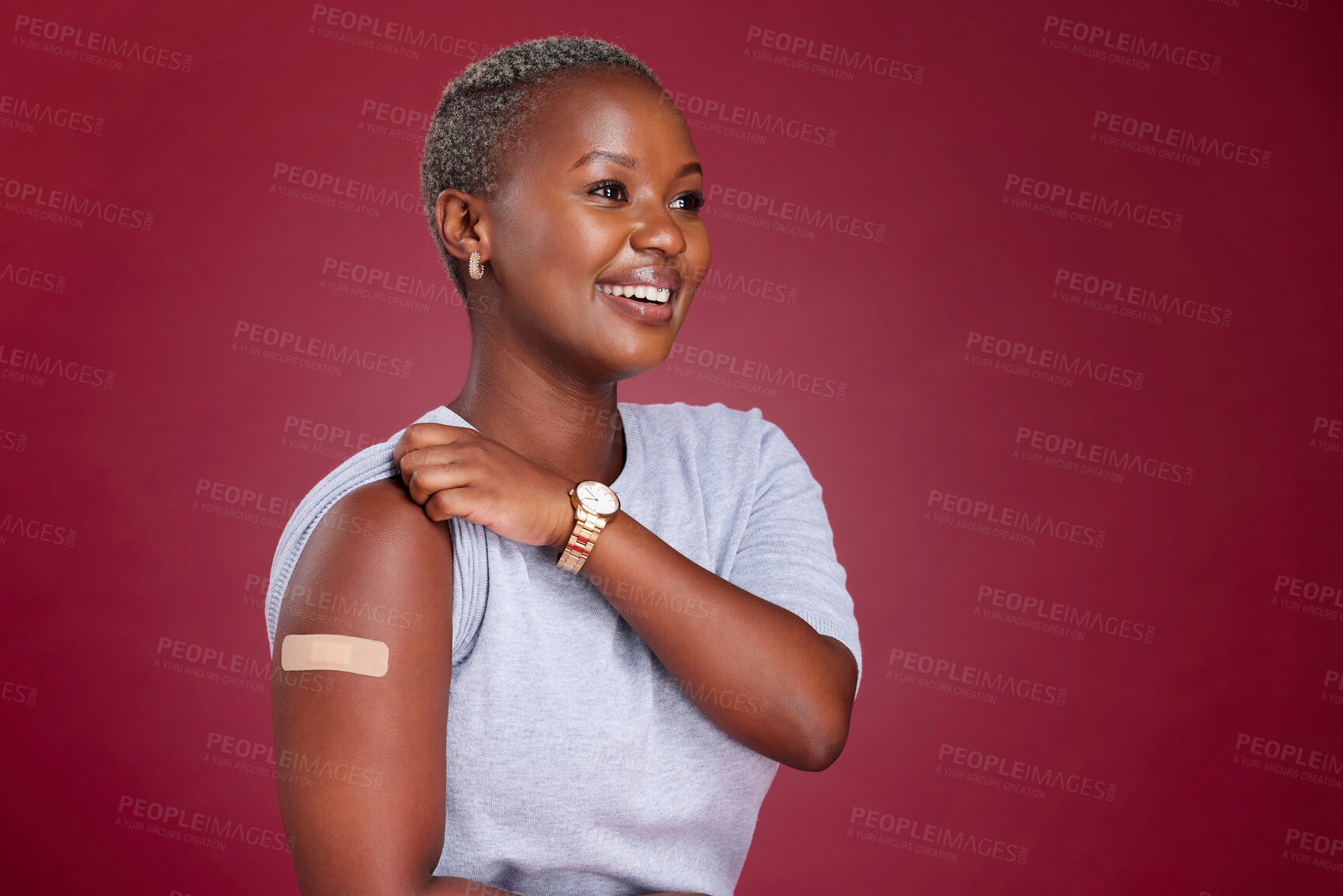 Buy stock photo Covid, vaccine and arm with a black woman in studio on a red background with mockup to promote health. Medical, medicine and healthcare with a female getting her vaccination during the corona virus