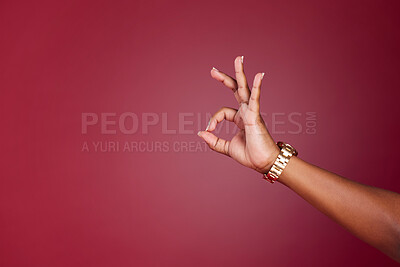 Buy stock photo Hand, woman and okay sign at a studio in support of decision, approve and yes closeup on red background mockup. Model hands and ok gesture by girl showing signal for approval, agree and continue
