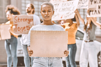 Buy stock photo Protest, sign and mockup with a black woman activist holding cardboard during a rally or demonstration. Poster, freedom and politics with a young female fighting for human rights or equality