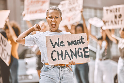 Buy stock photo Woman, angry protest and banner in city street for freedom, peace and social diversity. Young black girl, people walk in protesting rally together and community collaboration for feminist empowerment